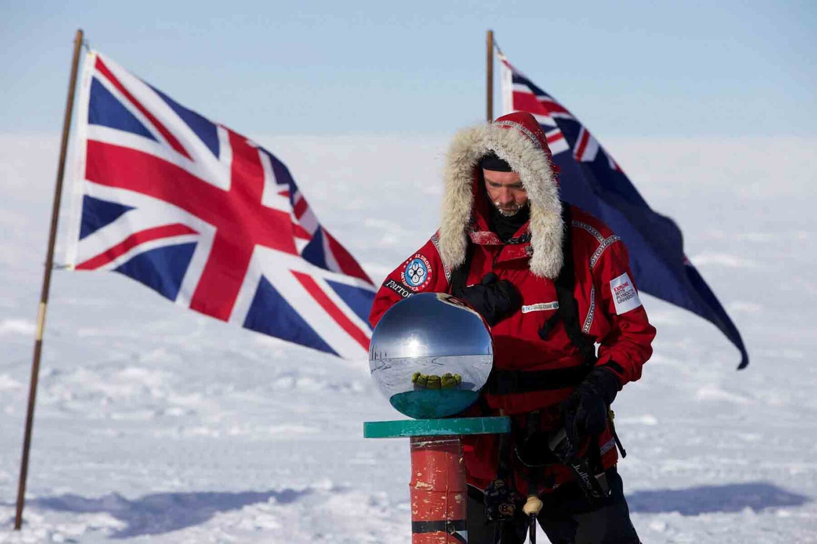 Antony Jinman beside the ceremonial South Pole marker, reflecting on his expedition